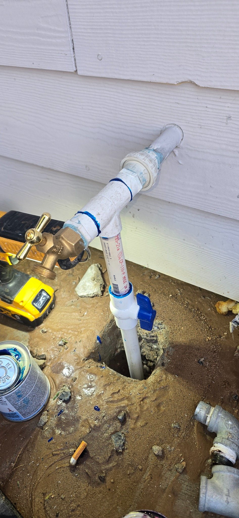 New PVC pipe and shutoff valve installed